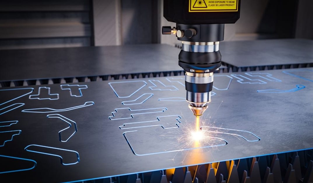 A laser cutting machine precisely cutting shapes into a sheet of metal with bright sparks.