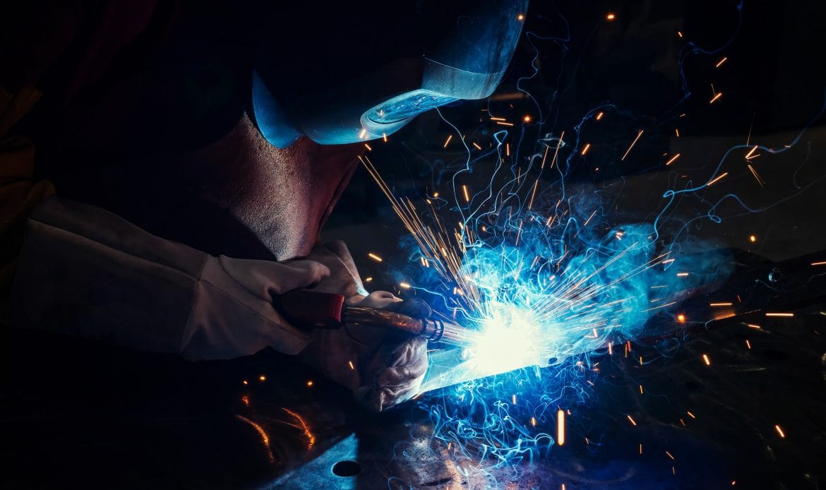 man welding